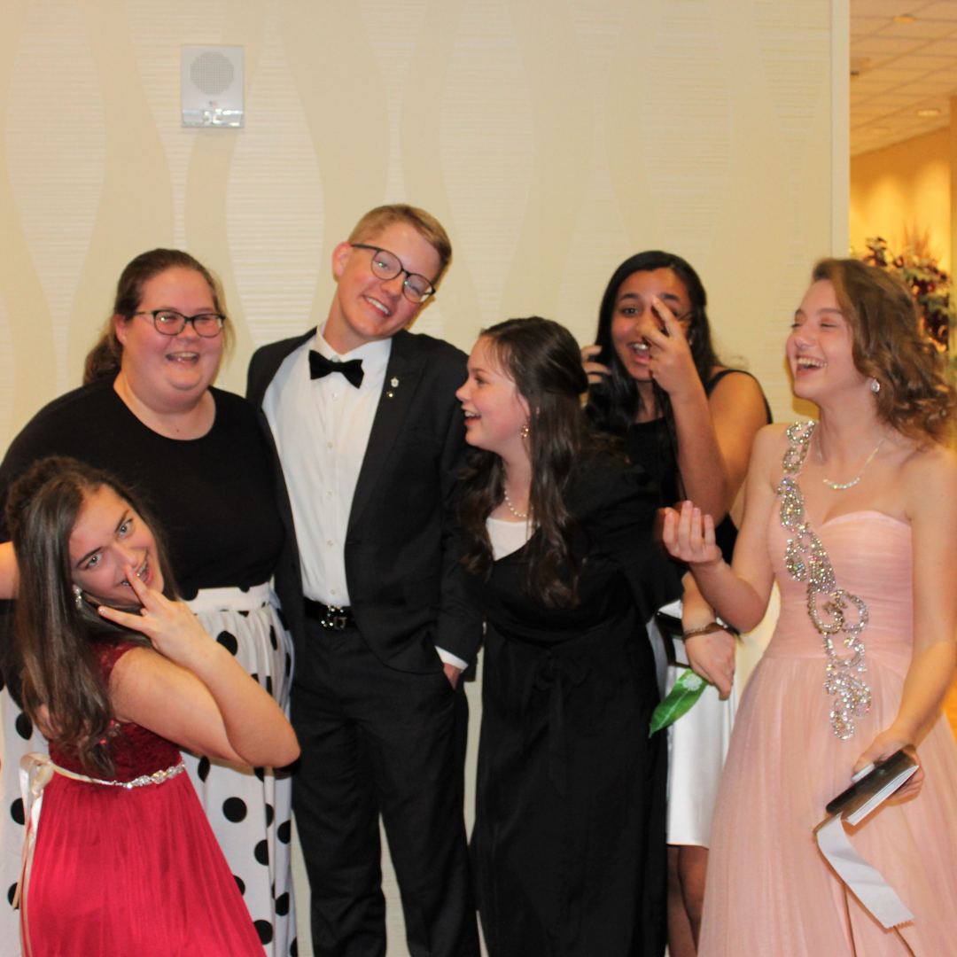 Photo of Kids Laughing in Formal Attire 