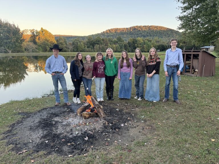 Youth on Lake near a bonfire