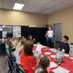 Jasper Beaty shows off art from get to know you activity.